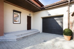 View of house entrance next to garage